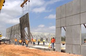 Construction workers. Industrial Painting Surface Prep Is Essential for Tilt-Up Concrete