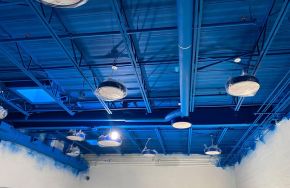 Blue warehouse ceiling after adding intumescent paint How Fire Resistive Paints Can Protect Your Assets