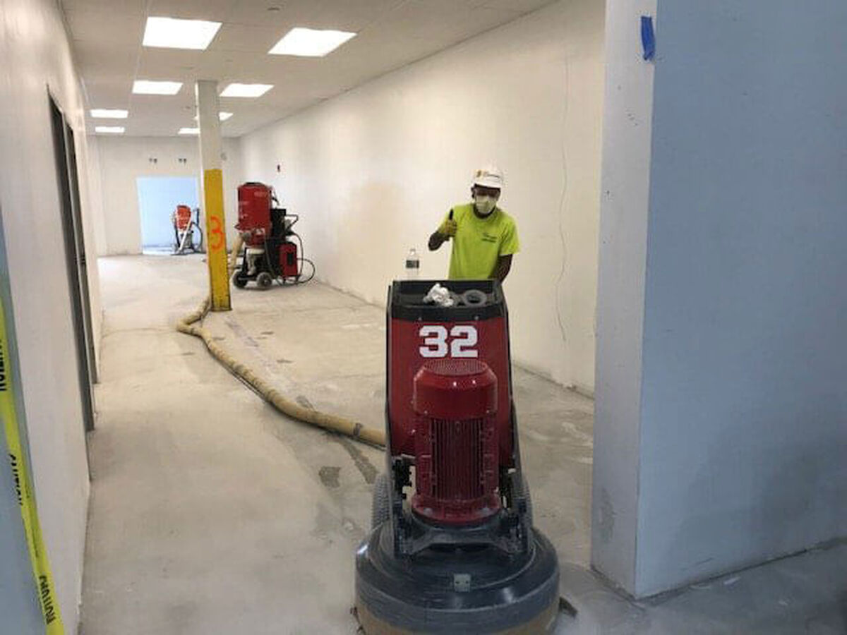 Kaloutas contractors repairing a concrete floor Kaloutas Can Handle the Difficult Projects and Solve Complexity Issues.