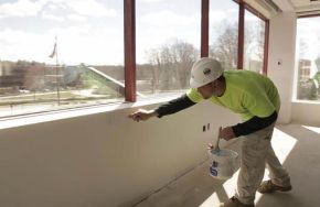 Kaloutas contractor working on caulking services Tips for Selecting Caulk for Your Commercial Painting Project