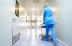 Empty hallway with medical practitioner. Should Your Floor Be Antimicrobial?